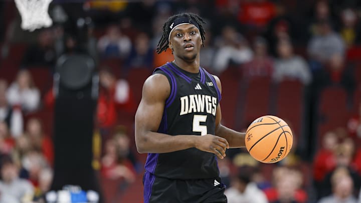 Mar 12, 2026; Chicago, IL, USA; Washington Huskies guard Zoom Diallo (5) brings the ball up court against the Wisconsin Badgers during the first half at United Center.