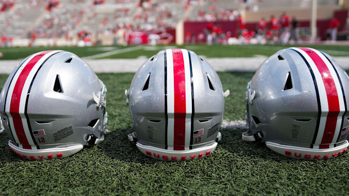 Sep 2, 2023; Bloomington, Indiana, USA; Ohio State Buckeyes helmets sit on the sideline prior to the NCAA football game at Indiana University Memorial Stadium.