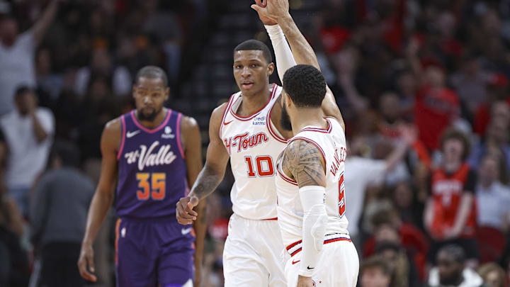 Feb 23, 2024; Houston, Texas, USA; Phoenix Suns forward Kevin Durant (35) reacts and Houston Rockets guard Fred VanVleet (5) celebrates with forward Jabari Smith Jr. (10) after a play during the third quarter at Toyota Center. Mandatory Credit: Troy Taormina-Imagn Images