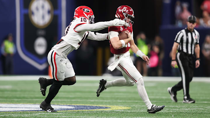 Dec 6, 2025; Atlanta, GA, USA; Alabama Crimson Tide quarterback Ty Simpson (15) scrambles and is tackled by Georgia Bulldogs linebacker Zayden Walker (10) during the fourth quarter during the 2025 SEC Championship game at Mercedes-Benz Stadium. Mandatory Credit: Brett Davis-Imagn Images Dec 6, 2025; Atlanta, GA, USA; Alabama Crimson Tide quarterback Ty Simpson (15) scrambles and is tackled by Georgia Bulldogs linebacker Zayden Walker (10) during the fourth quarter during the 2025 SEC Championship game at Mercedes-Benz Stadium. Mandatory Credit: Brett Davis-Imagn Images