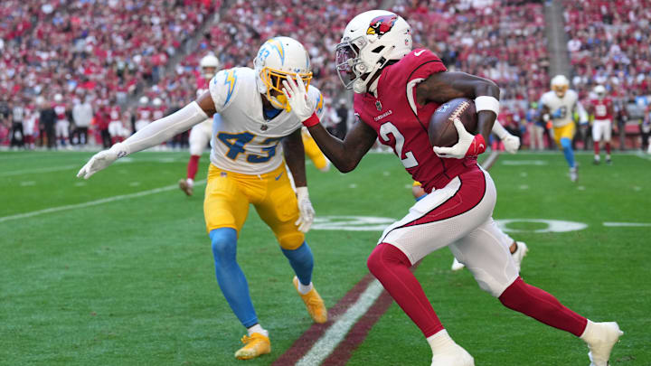 Nov 27, 2022; Glendale, Arizona, USA;  Arizona Cardinals wide receiver Marquise Brown (2) catches a pass against Los Angeles Chargers cornerback Michael Davis (43) in the first half at State Farm Stadium. Mandatory Credit: Joe Camporeale-Imagn Images
