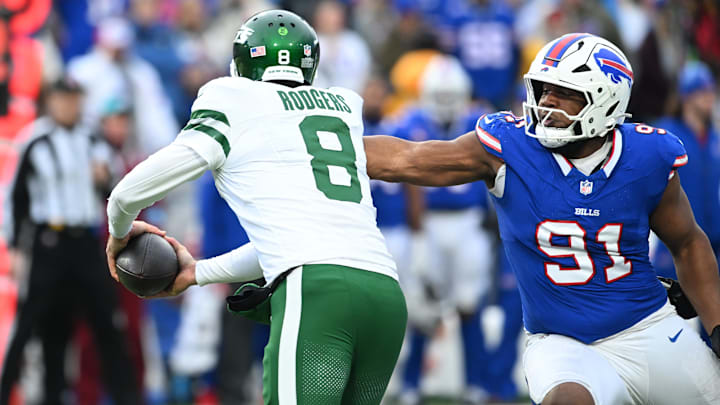 Dec 29, 2024; Orchard Park, New York, USA; Buffalo Bills defensive tackle Ed Oliver (91) sacks New York Jets quarterback Aaron Rodgers (8) in the third quarter at Highmark Stadium. Mandatory Credit: Mark Konezny-Imagn Images
