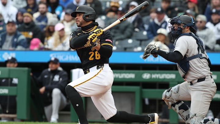 Apr 6, 2025; Pittsburgh, Pennsylvania, USA;  Pittsburgh Pirates left fielder Tommy Pham (28) hits a game winning RBI single to defeat the New York Yankees in the eleventh inning at PNC Park. Mandatory Credit: Charles LeClaire-Imagn Images