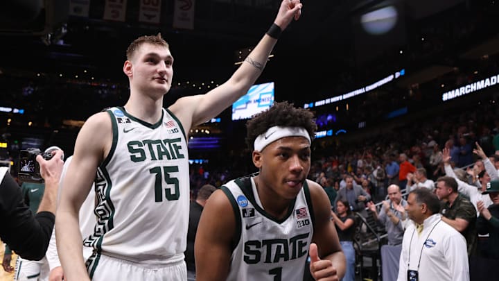 Mar 28, 2025; Atlanta, GA, USA; Michigan State Spartans center Carson Cooper (15) and guard Jeremy Fears Jr. (1) celebrate after defeating the Mississippi Rebels in a South Regional semifinal of the 2025 NCAA tournament at State Farm Arena. Mandatory Credit: Brett Davis-Imagn Images