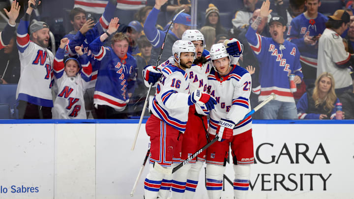 Dec 11, 2024; Buffalo, New York, USA;  New York Rangers center Mika Zibanejad (93) celebrates his goal with teammates during the first period against the Buffalo Sabres at KeyBank Center. Mandatory Credit: Timothy T. Ludwig-Imagn Images