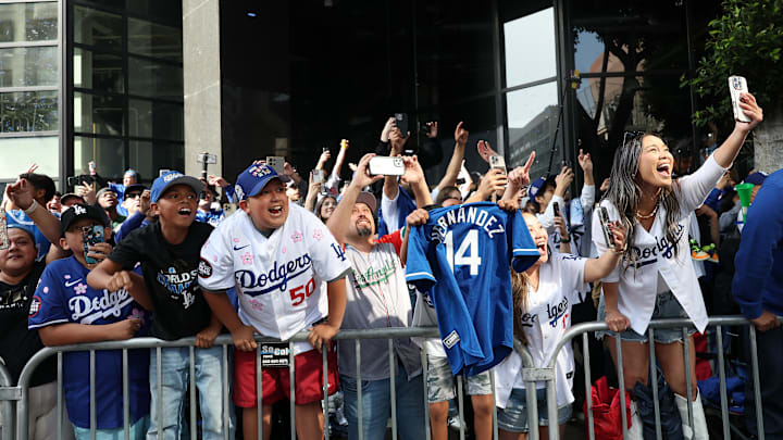 Nov 3, 2025; Los Angeles, CA, USA;  Los Angeles Dodgers fans cheer during the World Series championship parade at downtown Los Angeles. Mandatory Credit: Kiyoshi Mio-Imagn Images
