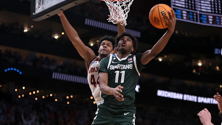 Mar 30, 2025; Atlanta, GA, USA; Michigan State Spartans guard Jase Richardson (11) shoots against Auburn Tigers center Dylan Cardwell (44) during the second half in the South Regional final of the 2025 NCAA tournament at State Farm Arena. Mandatory Credit: Brett Davis-Imagn Images Mar 30, 2025; Atlanta, GA, USA; Michigan State Spartans guard Jase Richardson (11) shoots against Auburn Tigers center Dylan Cardwell (44) during the second half in the South Regional final of the 2025 NCAA tournament at State Farm Arena. Mandatory Credit: Brett Davis-Imagn Images