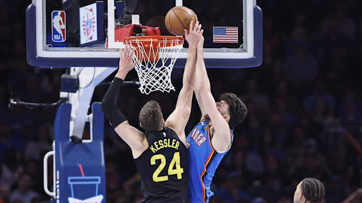 Mar 20, 2024; Oklahoma City, Oklahoma, USA; Oklahoma City Thunder forward Chet Holmgren (7) dunks as Utah Jazz center Walker Kessler (24) defends during the second half at Paycom Center. Mandatory Credit: Alonzo Adams-Imagn Images