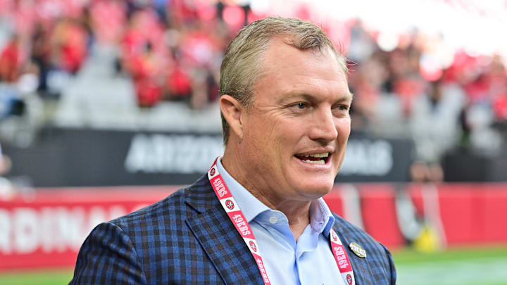 Nov 16, 2025; Glendale, Arizona, USA; San Francisco 49ers general manager John Lynch speaks on the sidelines before the game against the Arizona Cardinals at State Farm Stadium. Mandatory Credit: Matt Kartozian-Imagn Images