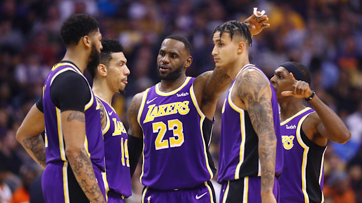 Nov 12, 2019; Phoenix, AZ, USA: Los Angeles Lakers forward LeBron James (23) talks with forward Anthony Davis (3), guard Danny Green (14), forward Kyle Kuzma (0) and guard Rajon Rondo (9) against the Phoenix Suns at Talking Stick Resort Arena. Mandatory Credit: Mark J. Rebilas-Imagn Images Nov 12, 2019; Phoenix, AZ, USA: Los Angeles Lakers forward LeBron James (23) talks with forward Anthony Davis (3), guard Danny Green (14), forward Kyle Kuzma (0) and guard Rajon Rondo (9) against the Phoenix Suns at Talking Stick Resort Arena. Mandatory Credit: Mark J. Rebilas-Imagn Images