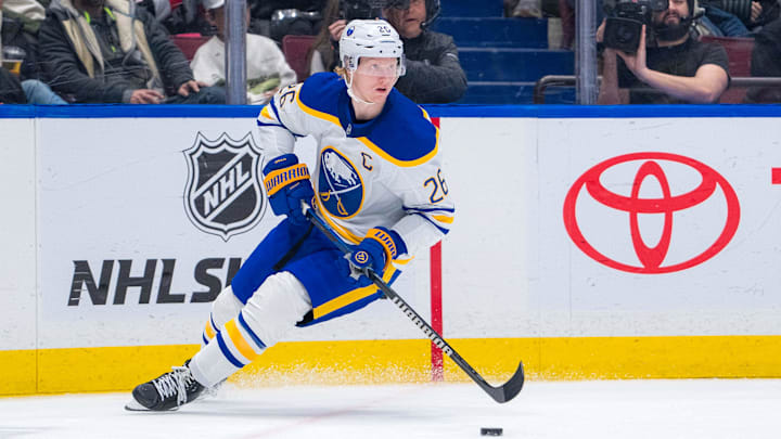 Jan 21, 2025; Vancouver, British Columbia, CAN; Buffalo Sabres defenseman Rasmus Dahlin (26) handles the puck against the Vancouver Canucks in the second period at Rogers Arena. Mandatory Credit: Bob Frid-Imagn Images