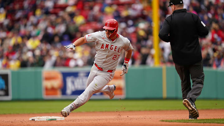 Los Angeles Angels center fielder Mike Trout (27) hits a triple against the Boston Red Sox in the eighth inning at Fenway Park in 2024. Los Angeles Angels center fielder Mike Trout (27) hits a triple against the Boston Red Sox in the eighth inning at Fenway Park in 2024.