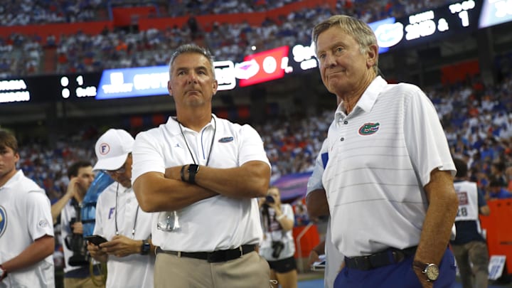 Sep 4, 2021; Gainesville, Florida, USA; Florida Gators former head coach Urban Meyer and Steve Spurrier on the sidelines during the first quarter against the Florida Atlantic Owls at Ben Hill Griffin Stadium. Mandatory Credit: Kim Klement-Imagn Images Sep 4, 2021; Gainesville, Florida, USA; Florida Gators former head coach Urban Meyer and Steve Spurrier on the sidelines during the first quarter against the Florida Atlantic Owls at Ben Hill Griffin Stadium. Mandatory Credit: Kim Klement-Imagn Images