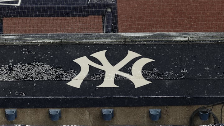 Aug 17, 2020; Bronx, New York, USA; A general view of rain falling on the New York Yankees logo on the first base dugout roof during a rain delay in the game between the New York Yankees and the Boston Red Sox. Mandatory Credit: Vincent Carchietta-Imagn Images Aug 17, 2020; Bronx, New York, USA; A general view of rain falling on the New York Yankees logo on the first base dugout roof during a rain delay in the game between the New York Yankees and the Boston Red Sox. Mandatory Credit: Vincent Carchietta-Imagn Images