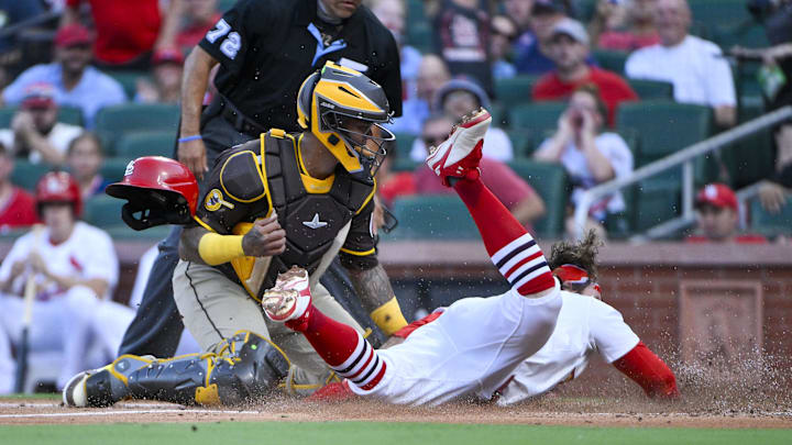 St. Louis Cardinals second baseman Brendan Donovan (33) slides safely past San Diego Padres catcher Martin Maldonado (15) during the first inning at Busch Stadium on July 24.