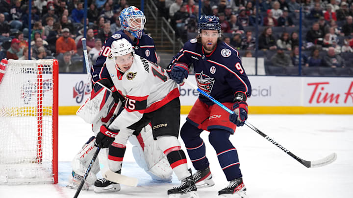 Blue Jackets defenseman Ivan Provorov clashes with Ottawa forward Matthew Highmore in front of Elvis Merzlikins. Blue Jackets defenseman Ivan Provorov clashes with Ottawa forward Matthew Highmore in front of Elvis Merzlikins.