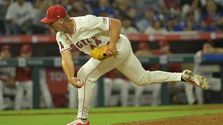 Angels relief pitcher Ben Joyce (44) strikes out Los Angeles Dodgers shortstop Tommy Edman (25) on a 105.5 mph pitch in the eighth inning at Angel Stadium. 