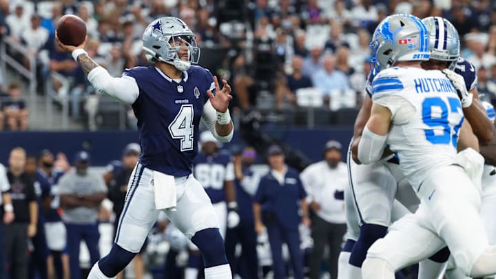 Oct 13, 2024; Arlington, Texas, USA;  Dallas Cowboys quarterback Dak Prescott (4) throws as Detroit Lions defensive end Aidan Hutchinson (97) rushes during the first quarter at AT&T Stadium.