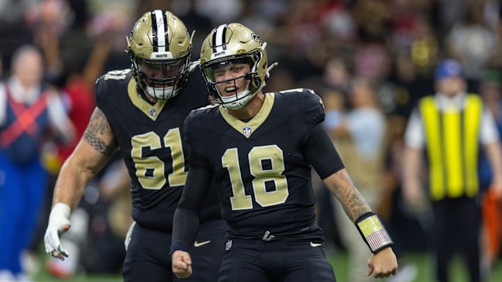 Oct 13, 2024; New Orleans, Louisiana, USA;  New Orleans Saints quarterback Spencer Rattler (18) reacts to throwing a touchdown against the Tampa Bay Buccaneers during the first half at Caesars Superdome. Mandatory Credit: Stephen Lew-Imagn Images