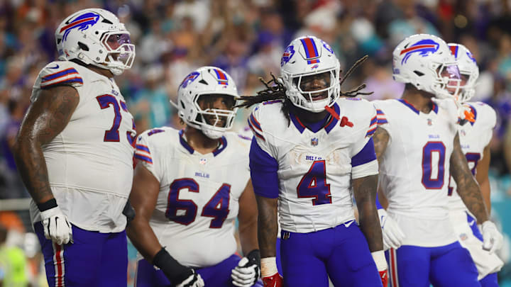 Sep 12, 2024; Miami Gardens, Florida, USA; Buffalo Bills running back James Cook (4) celebrates with teammates after scoring a touchdown against the Miami Dolphins during the second quarter at Hard Rock Stadium. 