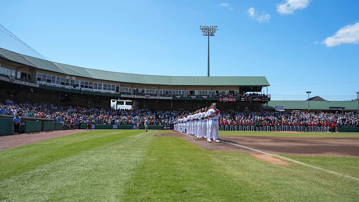 The Tennessee Smokies and Birmingham Barons stand for the National Anthem during the last regular season home game at the Tennessee Smokies Stadium on Sunday, September 15, 2024 in Kodak, Tenn.