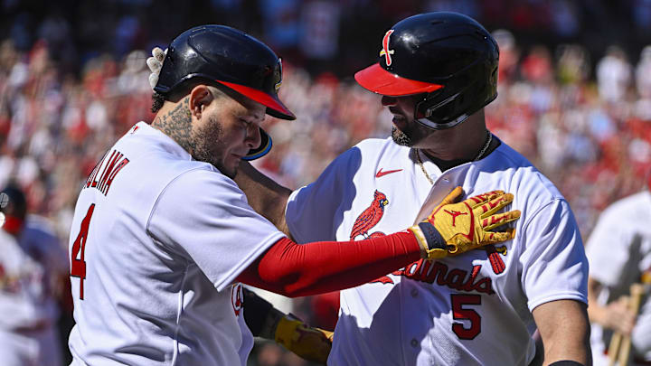 Oct 2, 2022; St. Louis, Missouri, USA;  St. Louis Cardinals first baseman Albert Pujols (5) celebrates with catcher Yadier Molina (4) after hitting a solo home run for his 702nd career home run during the third inning against the Pittsburgh Pirates at Busch Stadium. Mandatory Credit: Jeff Curry-Imagn Images