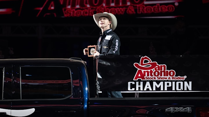 Dawson Hay takes a victory lap after claiming the San Antonio Stock Show & Rodeo's saddle bronc title like his father and brother. 