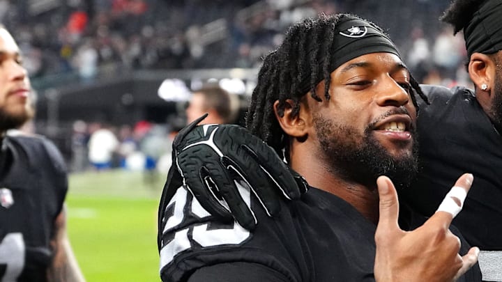 Jan 7, 2024; Paradise, Nevada, USA; Las Vegas Raiders safety Chris Smith II (29) and Las Vegas Raiders linebacker Amari Burney (56) celebrate after the Raiders defeated the Denver Broncos 27-14 at Allegiant Stadium. Mandatory Credit: Stephen R. Sylvanie-Imagn Images