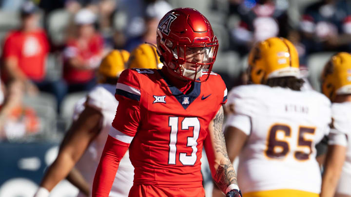 Nov 30, 2024; Tucson, Arizona, USA; Arizona Wildcats defensive back Jack Luttrell (13) against the Arizona State Sun Devils during the Territorial Cup at Arizona Stadium. Mandatory Credit: Mark J. Rebilas-Imagn Images