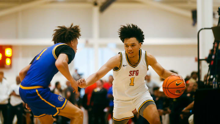 Team SFG’s Brayden Burries (1) looks to make a play against Team Boo Williams during the Nike Elite Youth Basketball League session one on Friday, April 26, 2024 at the Memphis Sports & Event Center in Memphis, Tenn.