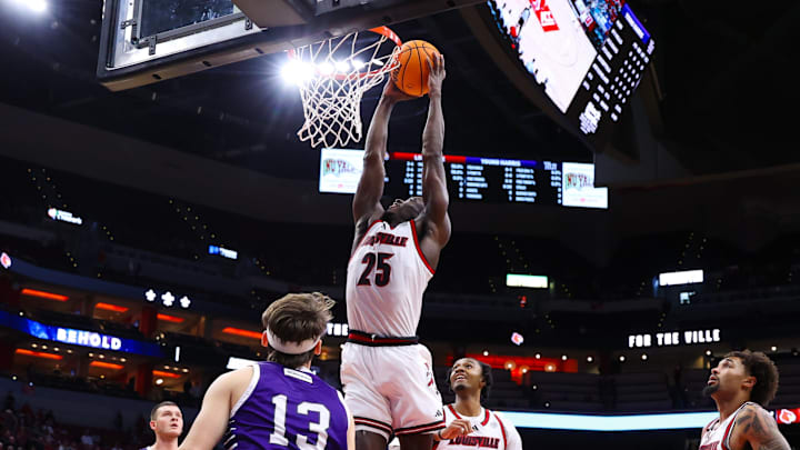 Louisville guard/forward Aboubacar Traore (25) dunks the ball in the Cardinals' exhibition matchup against Young Harris College. Louisville guard/forward Aboubacar Traore (25) dunks the ball in the Cardinals' exhibition matchup against Young Harris College.