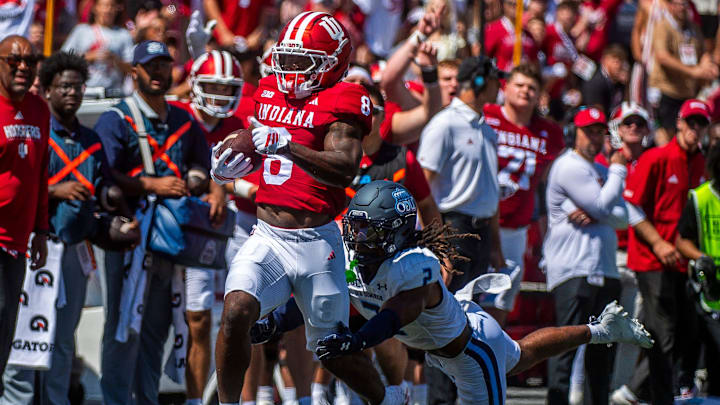 Indiana's Kaelon Black (8) avoids Old Dominion's Nickendre Stiger (2)during the Indiana versus Old Dominion football game at Memorial Stadium on Saturday, Aug. 30, 2025.