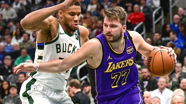 Mar 13, 2025; Milwaukee, Wisconsin, USA; Los Angeles Lakers guard Luka Doncic (77) drives to the basket against Milwaukee Bucks forward Giannis Antetokounmpo (34) in the third quarter at Fiserv Forum. Mandatory Credit: Benny Sieu-Imagn Images Mar 13, 2025; Milwaukee, Wisconsin, USA; Los Angeles Lakers guard Luka Doncic (77) drives to the basket against Milwaukee Bucks forward Giannis Antetokounmpo (34) in the third quarter at Fiserv Forum. Mandatory Credit: Benny Sieu-Imagn Images