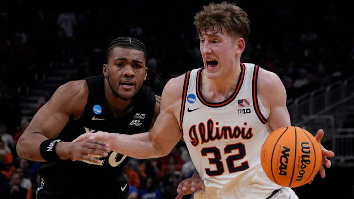 Illinois guard Kasparas Jakucionis (32) drives up to the basket as Xavier guard Dayvion McKnight (20) attempts to guard him during the second half of their first round NCAA men’ s basketball tournament game on Friday March 21, 2025 at Fiserv Forum in Milwaukee, Wis.