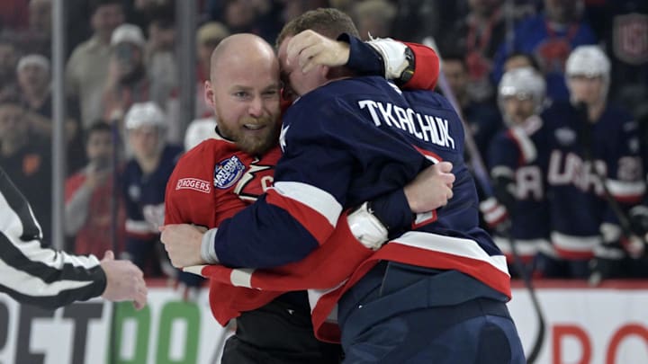 Feb 15, 2025; Montreal, Quebec, CAN; [Imagn Images direct customers only] Team Canada forward Sam Bennett (9) and Team United States forward Brady Tkachuk (7) fight in the first period during a 4 Nations Face-Off ice hockey game at the Bell Centre. Mandatory Credit: Eric Bolte-Imagn Images