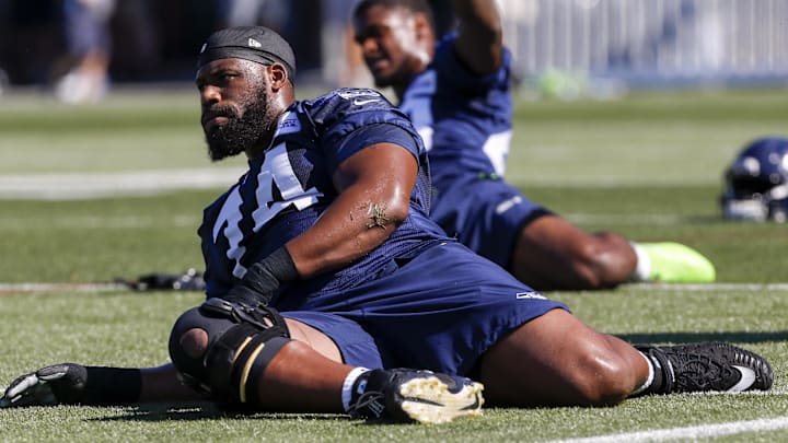 Seattle Seahawks offensive tackle George Fant stretches before a training camp practice at the Virginia Mason Athletic Center.