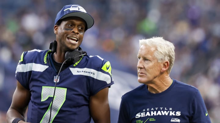 Aug 19, 2023; Seattle, Washington, USA; Seattle Seahawks quarterback Geno Smith (7) talks with head coach Pete Carroll during the second quarter against the Dallas Cowboys at Lumen Field. Mandatory Credit: Joe Nicholson-Imagn Images