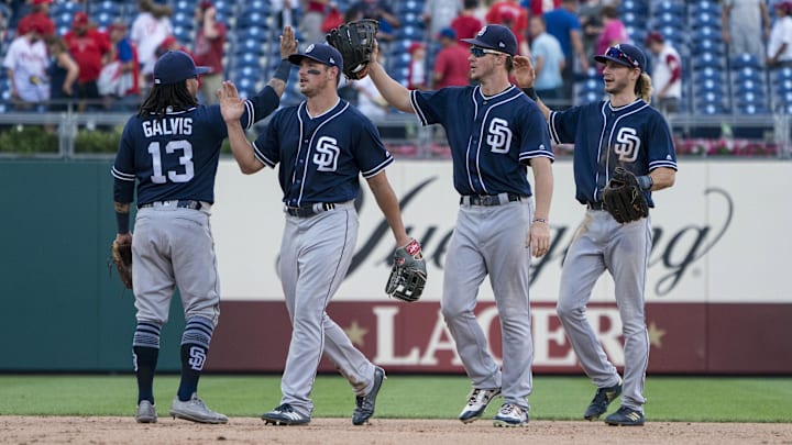 San Diego Padres shortstop Freddy Galvis (13) hi fives with San Diego Padres right fielder Will Myers (4) and San Diego Padres right fielder Hunter Renfroe (10) and San Diego Padres center fielder Travis Jankowski (16) after the last out in the ninth inning of the game against the Philadelphia Phillies at Citizens Bank Park on July 22, 2018.