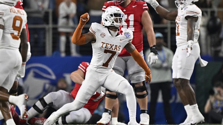 Jan 10, 2025; Arlington, Texas, USA; Texas Longhorns defensive back Jahdae Barron (7) celebrates after a sack during the second quarter of the College Football Playoff semifinal against the Ohio State Buckeyes in the Cotton Bowl at AT&T Stadium. Mandatory Credit: Jerome Miron-Imagn Images