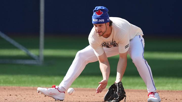 May 26, 2026; Toronto, Ontario, CAN; Toronto Blue Jays second baseman Ernie Clement (22) fields balls during batting practice before a game against the Miami Marlins at the Rogers Centre. 