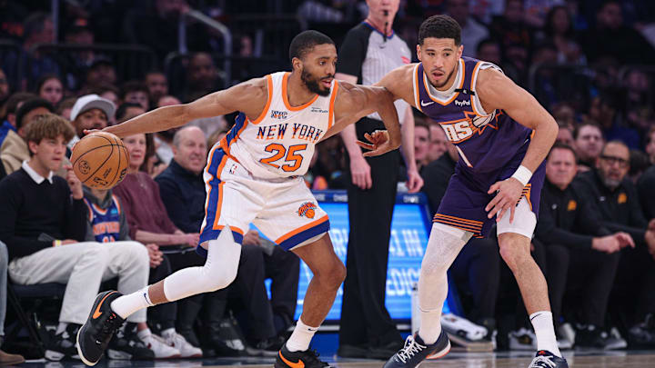 Apr 6, 2025; New York, New York, USA; New York Knicks forward Mikal Bridges (25) is guarded by Phoenix Suns guard Devin Booker (1) during the first half at Madison Square Garden. Mandatory Credit: Vincent Carchietta-Imagn Images Apr 6, 2025; New York, New York, USA; New York Knicks forward Mikal Bridges (25) is guarded by Phoenix Suns guard Devin Booker (1) during the first half at Madison Square Garden. Mandatory Credit: Vincent Carchietta-Imagn Images