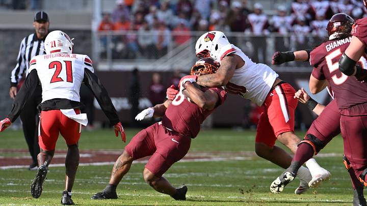 Louisville Cardinals defensive lineman Rene Konga (90) tackles Virginia Tech Hokies running back Terion Stewart (8) during the second quarter at Lane Stadium last season.