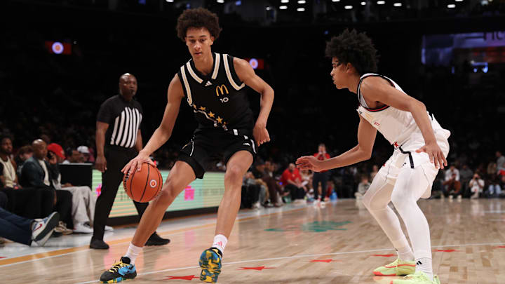Apr 1, 2025; Brooklyn, NY, USA; McDonald's All American East forward Nate Ament (10) dribbles the ball against McDonald's All American West guard Mikel Brown Jr. (11) during the second half of the game at Barclays Center. Mandatory Credit: Pamela Smith-Imagn Images