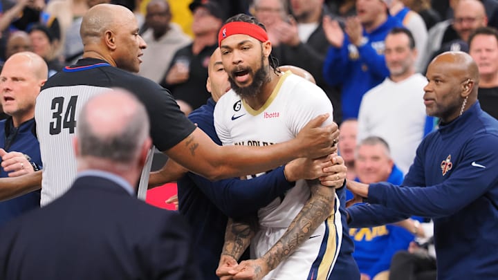 New Orleans Pelicans small forward Brandon Ingram (14) is held back referee Kevin Cutler (34) and Pelicans staff during the second quarter against the Golden State Warriors at Chase Center. Mandatory Credit: Kelley L Cox-Imagn Images