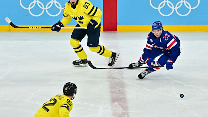 [US, Mexico & Canada customers only] Feb 18, 2026; Milan, Italy; Mika Zibanejad of Sweden in action with Charlie McAvoy of United States in a men's ice hockey quarterfinal during the Milano Cortina 2026 Olympic Winter Games at Milano Santagiulia Ice Hockey Arena. Mandatory Credit: Marton Monus/Reuters via Imagn Images