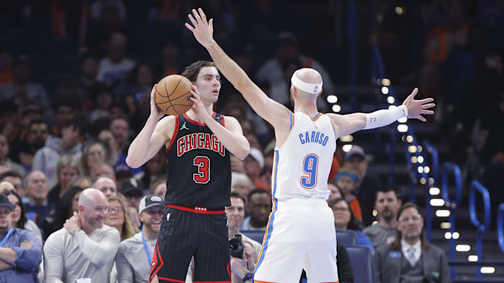 Mar 31, 2025; Oklahoma City, Oklahoma, USA; Chicago Bulls guard Josh Giddey (3) looks to pass as Oklahoma City Thunder guard Alex Caruso (9) defends during the second quarter at Paycom Center. Mandatory Credit: Alonzo Adams-Imagn Images