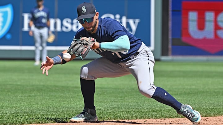 Seattle Mariners shortstop Jose Caballero fields a ball against the Kansas City Royals on Aug. 17, 2023, at Kauffman Stadium.