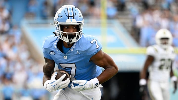 Sep 7, 2024; Chapel Hill, North Carolina, USA; North Carolina Tar Heels wide receiver Christian Hamilton (7) with the ball in the second quarter at Kenan Memorial Stadium. Mandatory Credit: Bob Donnan-Imagn Images