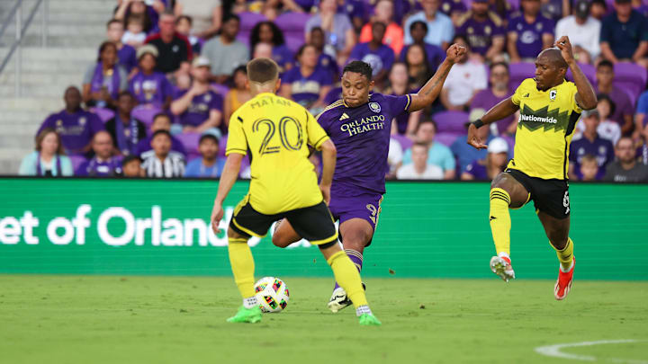 May 25, 2024; Orlando, Florida, USA; Orlando City forward Luis Muriel (9) attempts to pass the ball past Columbus Crew midfielder Alexandru Matan (20) during the first half at Inter&Co Stadium. Mandatory Credit: Kim Klement Neitzel-USA TODAY Sports