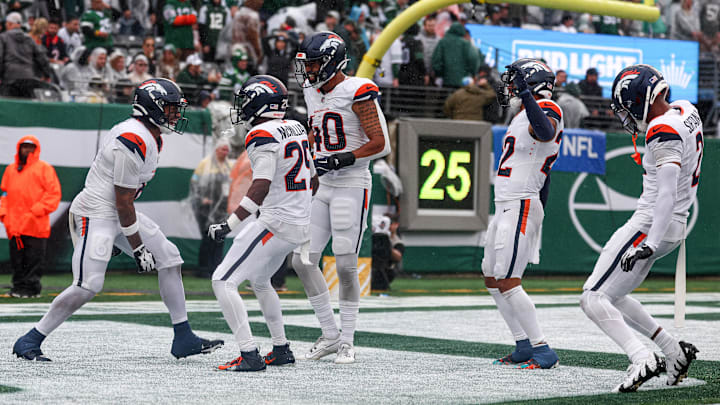Sep 29, 2024; East Rutherford, New Jersey, USA; Denver Broncos safety P.J. Locke (6) celebrates a fourth quarter, fourth down defensive stop with teammates during the second half against the New York Jets at MetLife Stadium. Sep 29, 2024; East Rutherford, New Jersey, USA; Denver Broncos safety P.J. Locke (6) celebrates a fourth quarter, fourth down defensive stop with teammates during the second half against the New York Jets at MetLife Stadium.